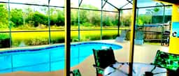 Ref 994PF. Modern lake view pool home. Very close to Disney